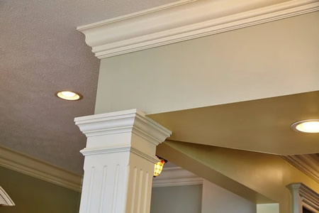 Electrician installing ic rated led recessed light in san jose living room